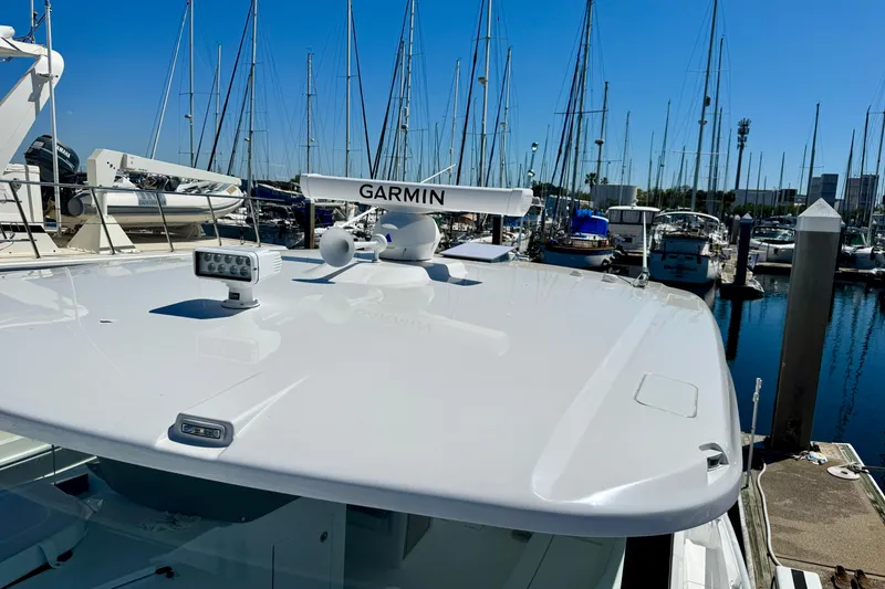 Slide: The Image of 2025 Intrepid 50 Evolution yacht with Garmin radar at marina. - 42