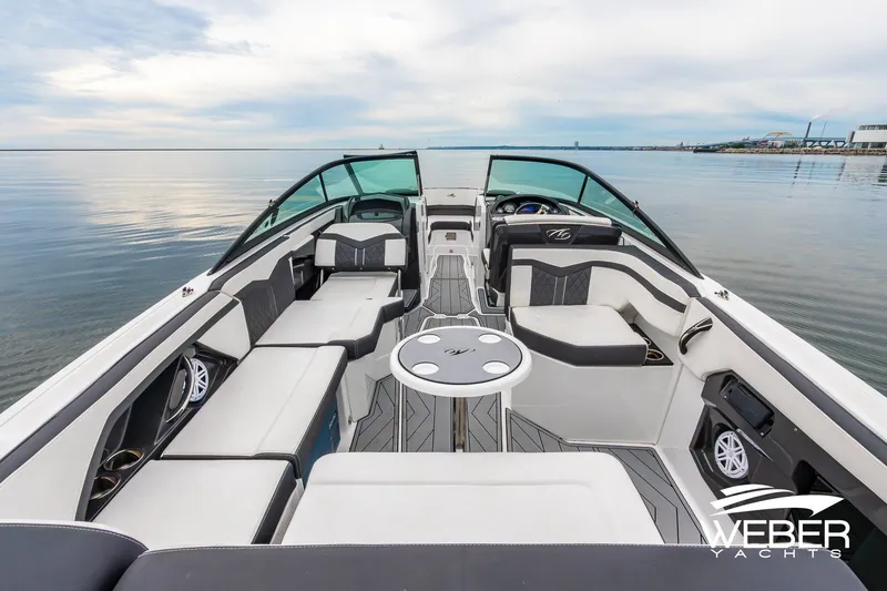 Slide: The Image of 2023 Monterey 255SS Super Sport boat interior with sleek seating and modern design on calm water. - 20