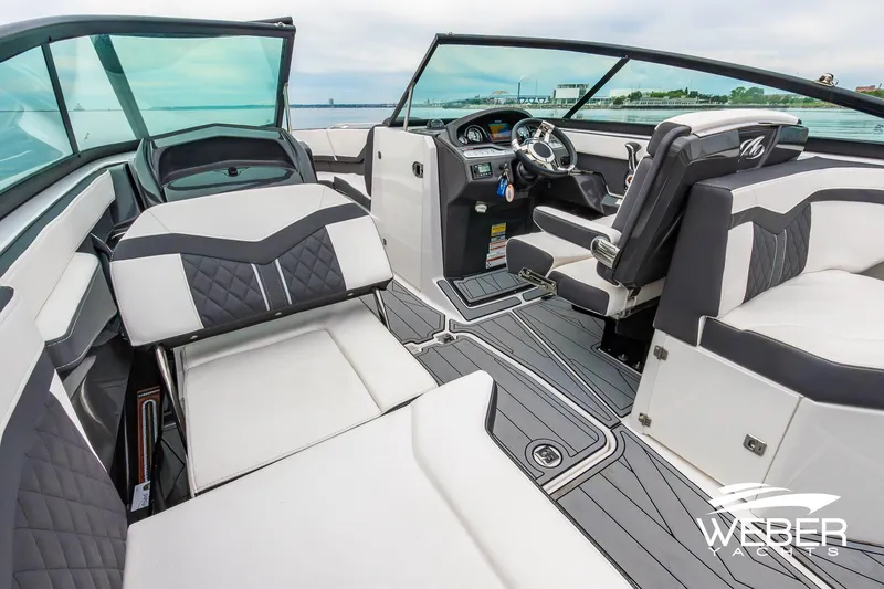 Slide: The Image of 2023 Monterey 255SS Super Sport boat interior with modern seating and dashboard. - 23