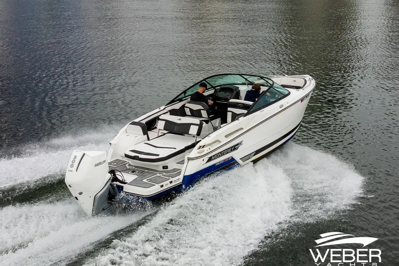 Slide: The Image of 2023 Monterey 255SS Super Sport boat cruising on water, showcasing sleek design and powerful engine. - 14