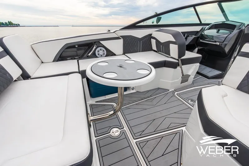 Slide: The Image of Luxurious interior of 2023 Monterey 255SS Super Sport boat with sleek seating and table. - 26