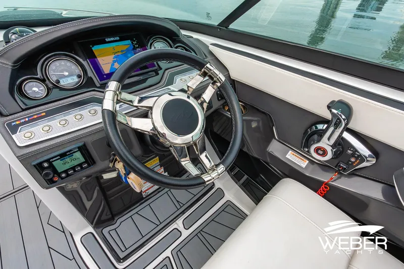 Slide: The Image of 2023 Monterey 255SS Super Sport boat dashboard with steering wheel and control panel. - 30