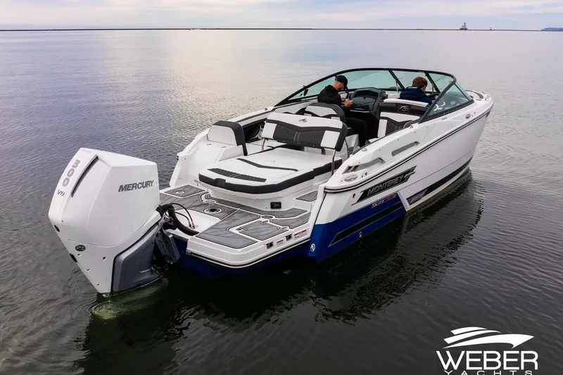 Slide: The Image of 2023 Monterey 255SS Super Sport boat on calm water, featuring a Mercury outboard engine. - 4