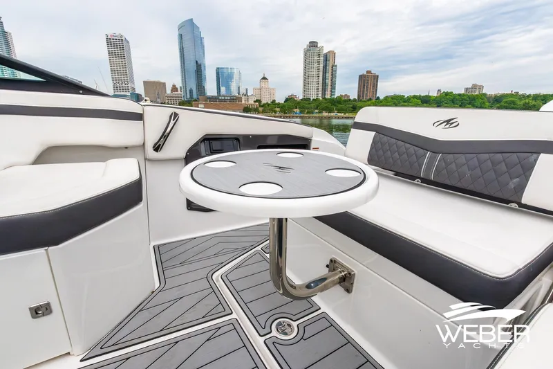 Slide: The Image of 2023 Monterey 255SS Super Sport boat interior with city skyline in background. - 24