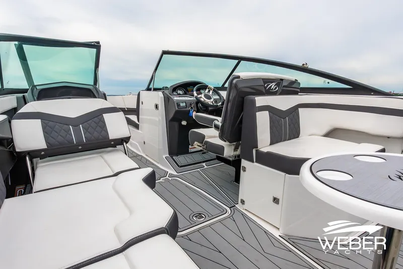Slide: The Image of 2023 Monterey 255SS Super Sport boat interior with luxurious seating and modern dashboard. - 25