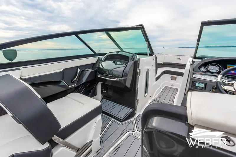 Slide: The Image of 2023 Monterey 255SS Super Sport boat interior with sleek design and modern dashboard. - 32