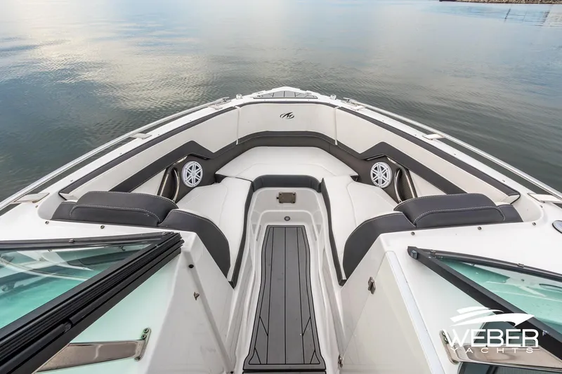 Slide: The Image of 2023 Monterey 255SS Super Sport boat interior with sleek seating and modern design on calm water. - 33