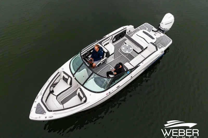 Slide: The Image of 2023 Monterey 255SS Super Sport boat on water, aerial view, featuring sleek design and spacious seating. - 10