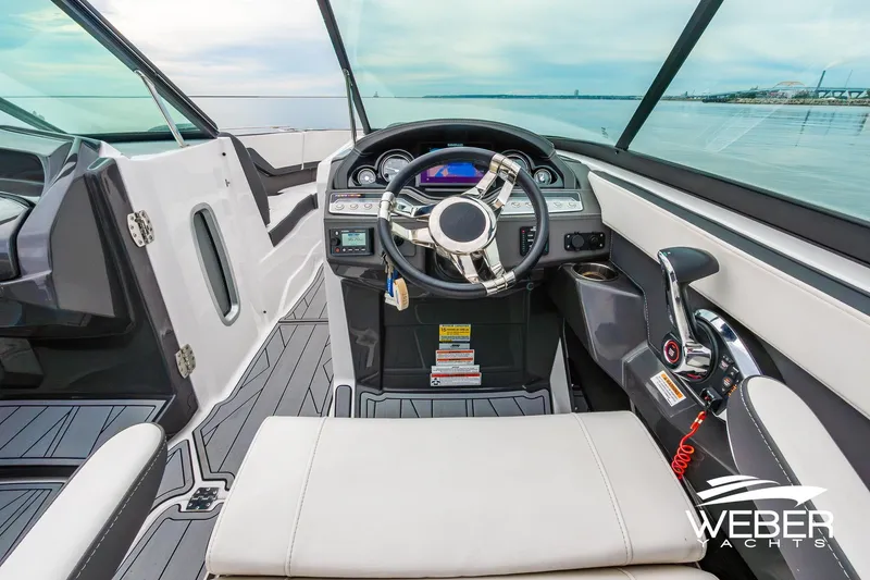 Slide: The Image of 2023 Monterey 255SS Super Sport boat cockpit with modern steering and controls. - 29