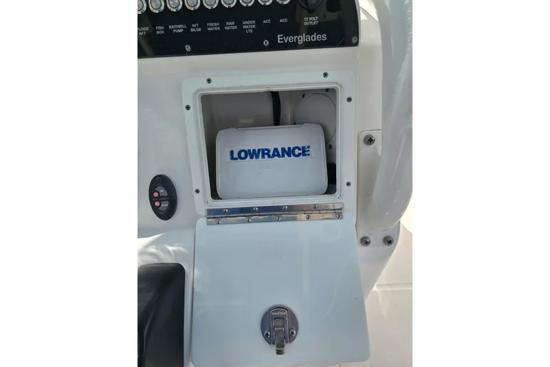 Slide: The Image of 2014 Everglades 243 Center Console with Lowrance equipment compartment. - 13