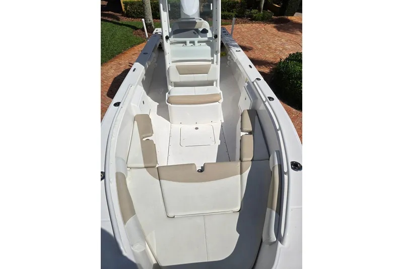 Slide: The Image of 2014 Everglades 243 Center Console boat with spacious seating and sleek design. - 14