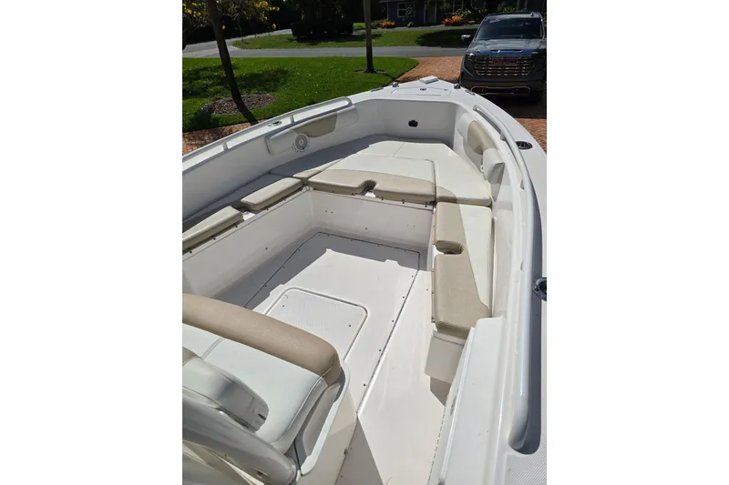 Slide: The Image of 2014 Everglades 243 Center Console boat with spacious seating and sleek design. - 15