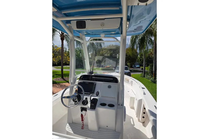 Slide: The Image of 2014 Everglades 243 Center Console boat interior with steering wheel and dashboard. - 6