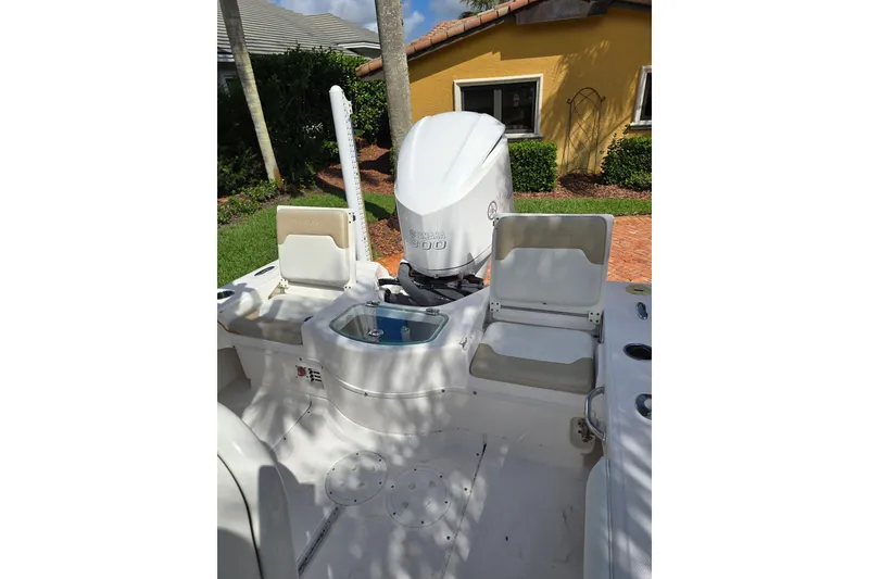 Slide: The Image of 2014 Everglades 243 Center Console boat with Yamaha engine, outdoor setting. - 9