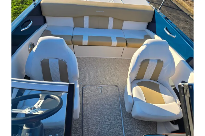 Slide: The Image of 2016 Glastron GT 185 boat interior with beige and white seating arrangement. - 19