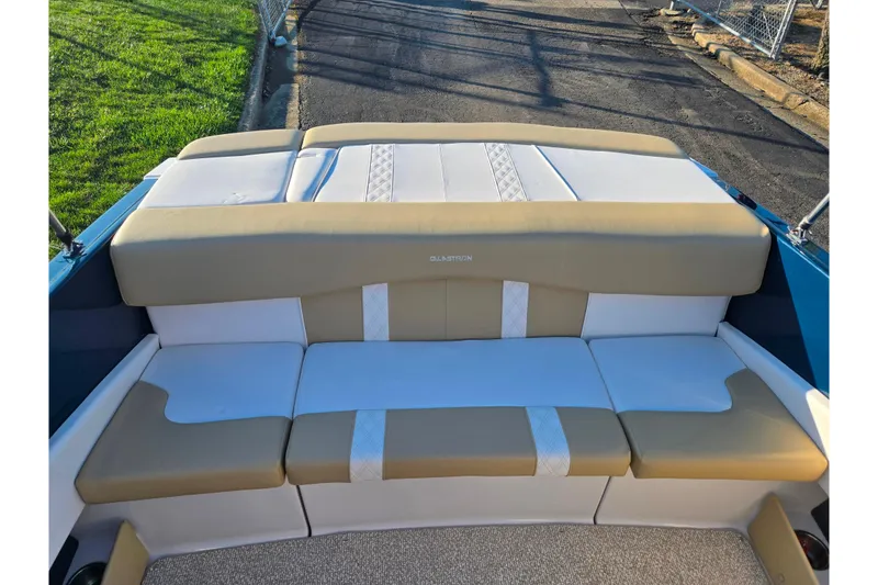 Slide: The Image of 2016 Glastron GT 185 boat interior with beige and white seating. - 20