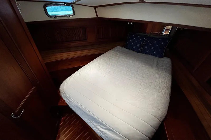 Slide: The Image of Cozy cabin interior of 2001 Sabre 34 yacht with bed and wooden finish. - 10