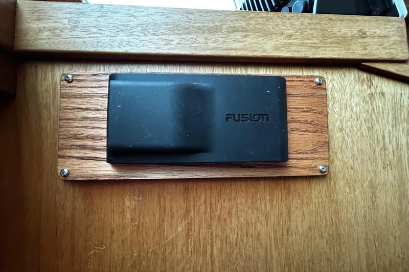 Slide: The Image of Black Fusion device mounted on wooden panel in a 2001 Sabre 34 boat interior. - 14