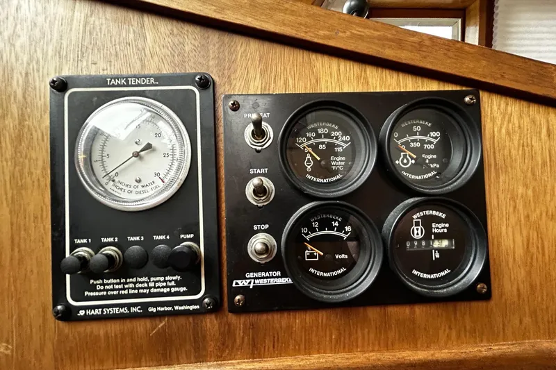 Slide: The Image of Control panel with gauges and switches on a 2001 Sabre 34 boat. - 15