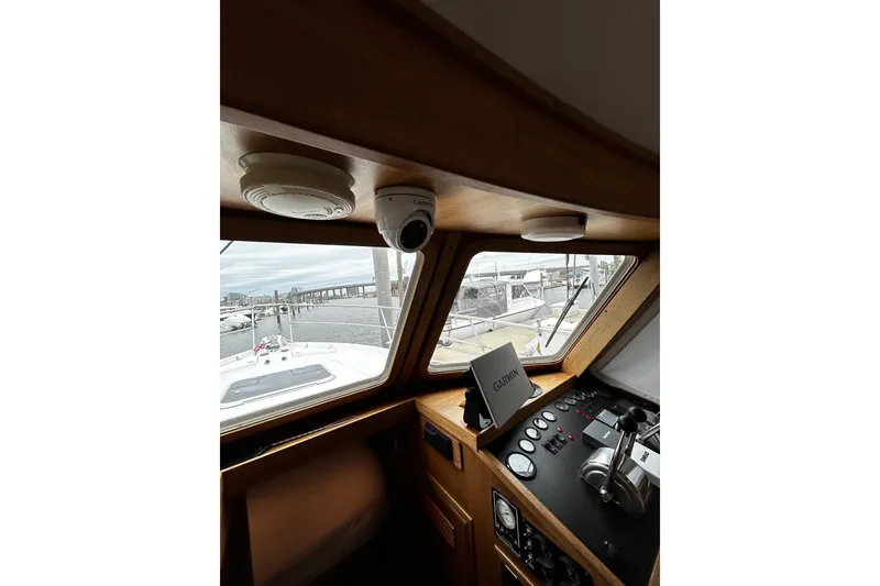 Slide: The Image of Interior view of a 2001 Sabre 34 boat cockpit with navigation equipment. - 19