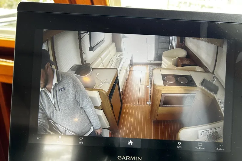 Slide: The Image of Interior view of a 2001 Sabre 34 yacht, featuring a cozy cabin and modern amenities. - 23