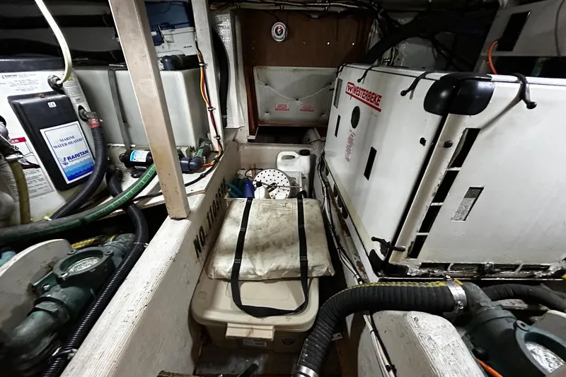 Slide: The Image of Engine room of a 2001 Sabre 34 boat with various equipment and wiring. - 26