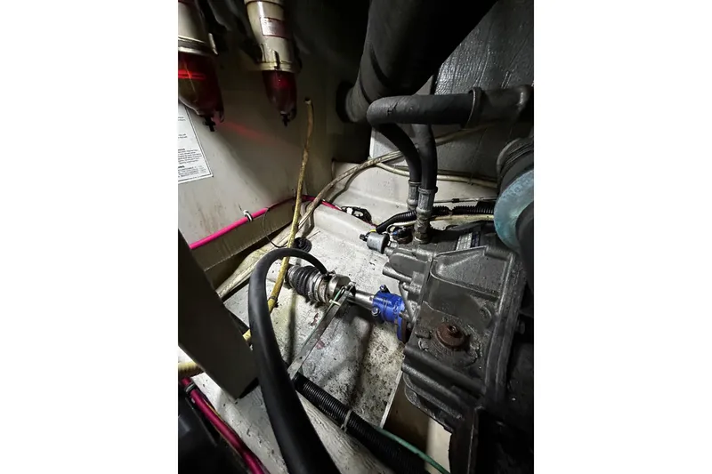 Slide: The Image of Engine compartment of a 2001 Sabre 34 boat, showing hoses and mechanical components. - 31