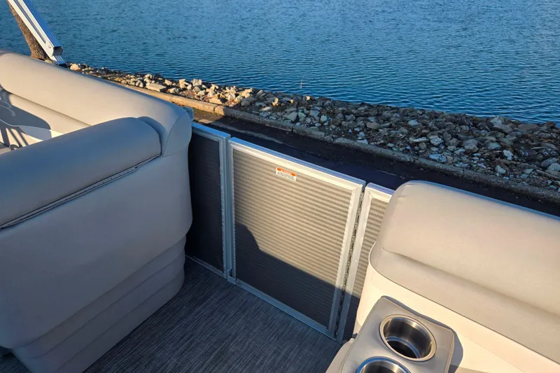 Slide: The Image of 2021 Bennington S 20 L-Bench pontoon boat interior with lake view. - 12