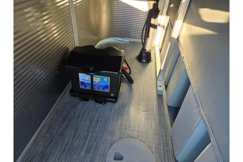 Slide: The Image of Interior of 2021 Bennington S 20 L-Bench with battery and wiring. - 18