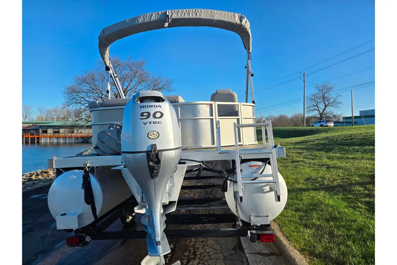 Slide: The Image of 2021 Bennington S 20 L-Bench pontoon boat with Honda 90 VTEC engine. - 2