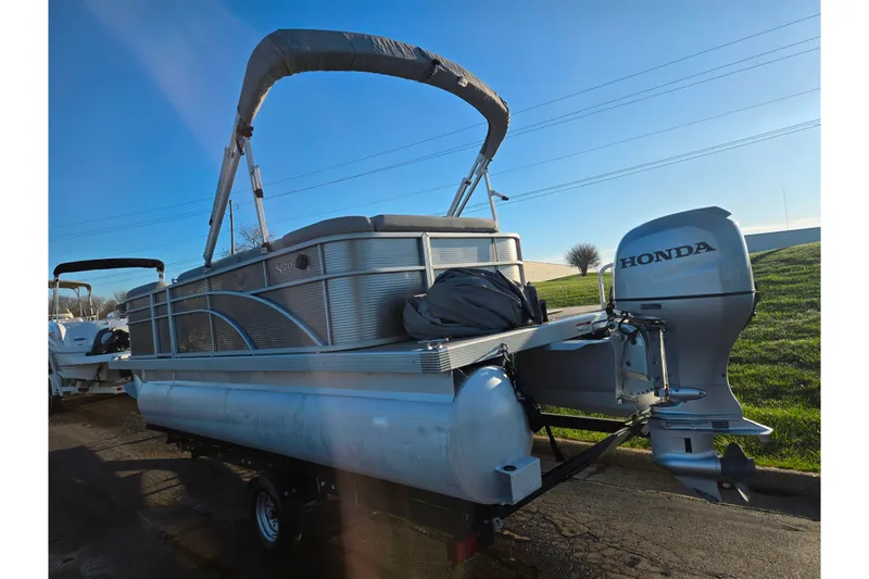 Slide: The Image of 2021 Bennington S 20 L-Bench pontoon boat with Honda outboard motor. - 3