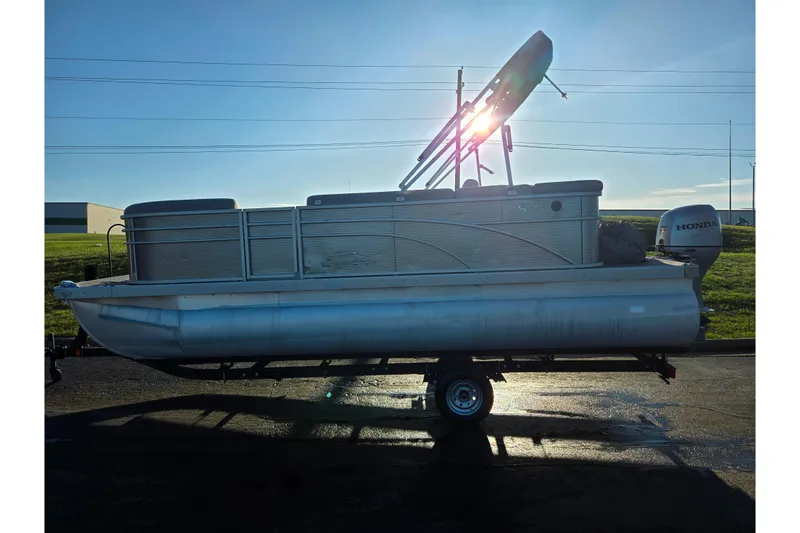 Slide: The Image of 2021 Bennington S 20 L-Bench pontoon boat on trailer, side view. - 4