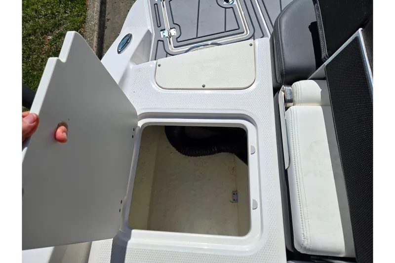 Slide: The Image of Open storage compartment on 2024 Chaparral 21 SSi boat, showcasing interior space. - 27