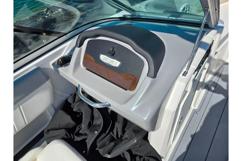 Slide: The Image of 2024 Chaparral 21 SSi boat interior with glove compartment and seating. - 6