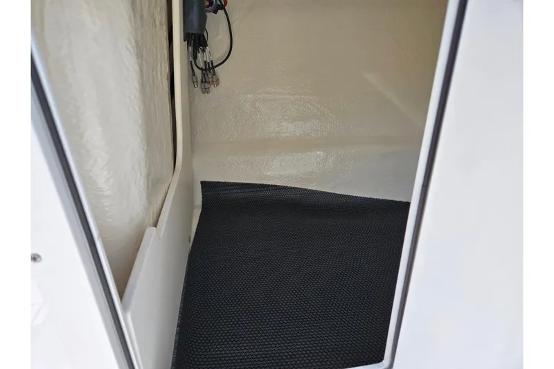 Slide: The Image of Interior storage compartment of 2024 Chaparral 21 SSi boat with wiring details. - 7