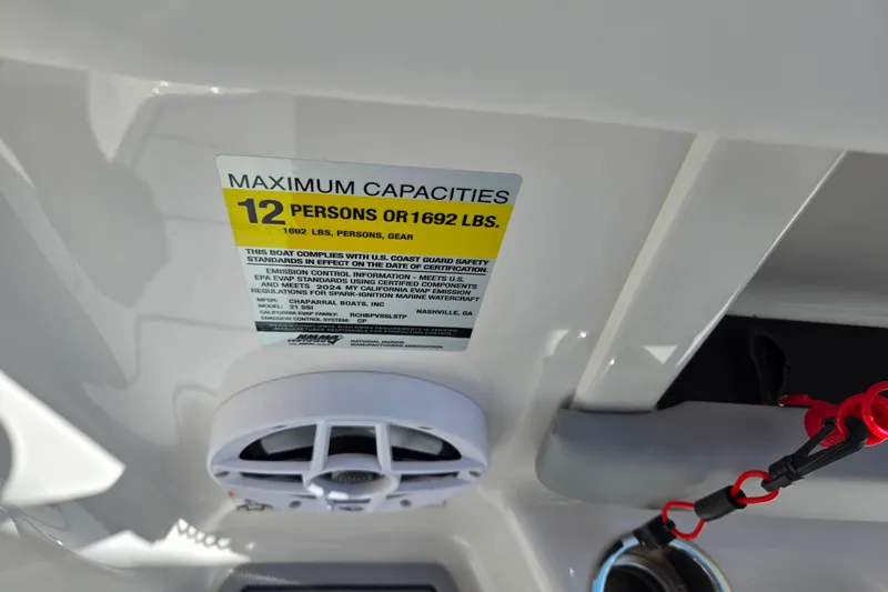 Slide: The Image of 2024 Chaparral 21 SSi boat capacity label, maximum 12 persons or 1692 lbs. - 9