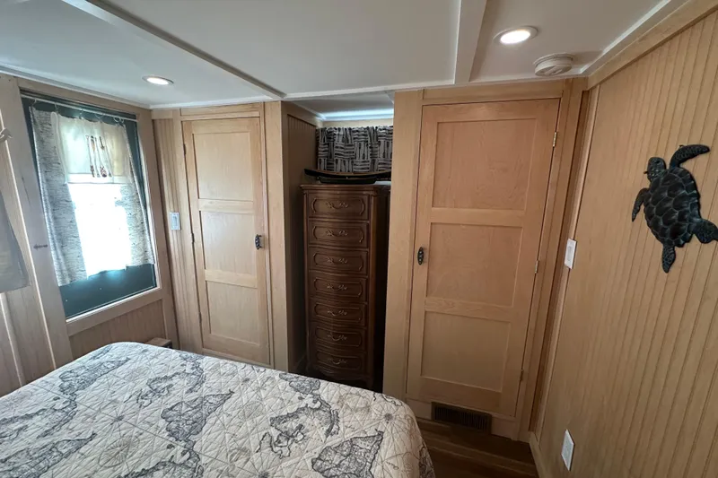 Slide: The Image of Cozy bedroom in 1974 Lazy Days 14x56 model with wooden decor and turtle wall art. - 10