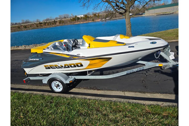 Slide: The Image of 2008 Sea-Doo 150 Speedster boat on trailer by a lake, sunny day. - 10