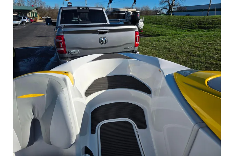 Slide: The Image of 2008 Sea-Doo 150 Speedster boat interior with truck in background, parked on grass. - 16