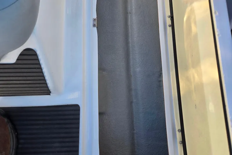 Slide: The Image of Interior view of a 2008 Sea-Doo 150 Speedster boat, showcasing seating and flooring. - 17