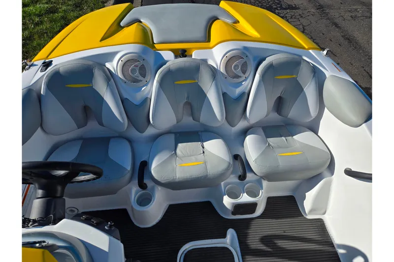 Slide: The Image of 2008 Sea-Doo 150 Speedster interior with gray and yellow seating, steering wheel, and cup holders. - 20