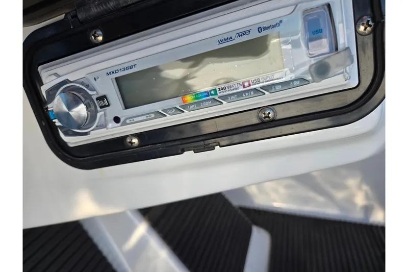 Slide: The Image of Close-up of a 2008 Sea-Doo 150 Speedster stereo system with USB and Bluetooth features. - 21