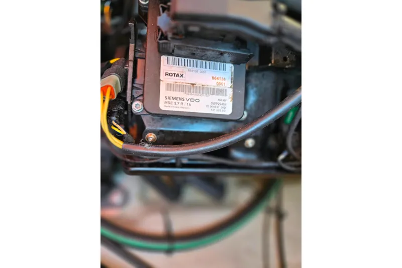 Slide: The Image of Close-up of 2008 Sea-Doo 150 Speedster engine component with Rotax and Siemens VDO labels. - 26