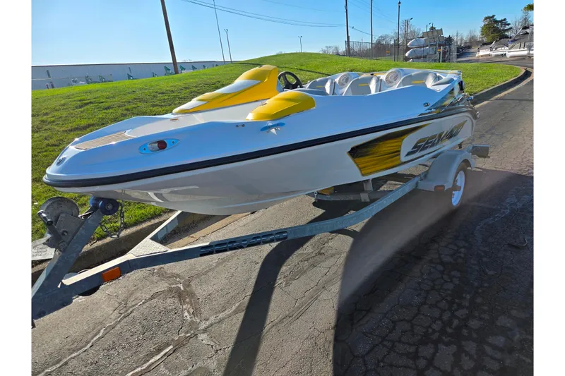 Slide: The Image of 2008 Sea-Doo 150 Speedster boat on trailer, parked on a sunny day. - 6