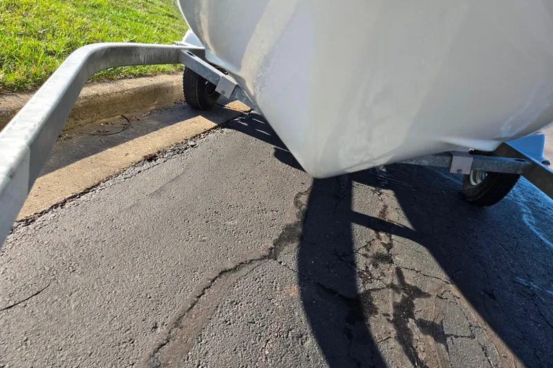 Slide: The Image of 2008 Sea-Doo 150 Speedster on trailer, parked on asphalt near grass. - 8