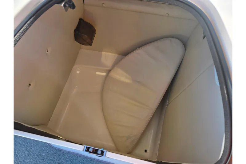 Slide: The Image of Storage compartment of 2005 Chaparral Sunesta 232 boat with cushion inside. - 17