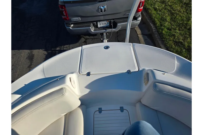 Slide: The Image of 2005 Chaparral Sunesta 232 boat interior with truck in background. - 19