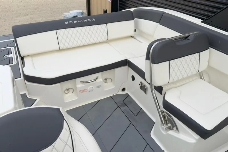 Slide: The Image of 2022 Bayliner DX 2250 boat interior with white and gray seating. - 5