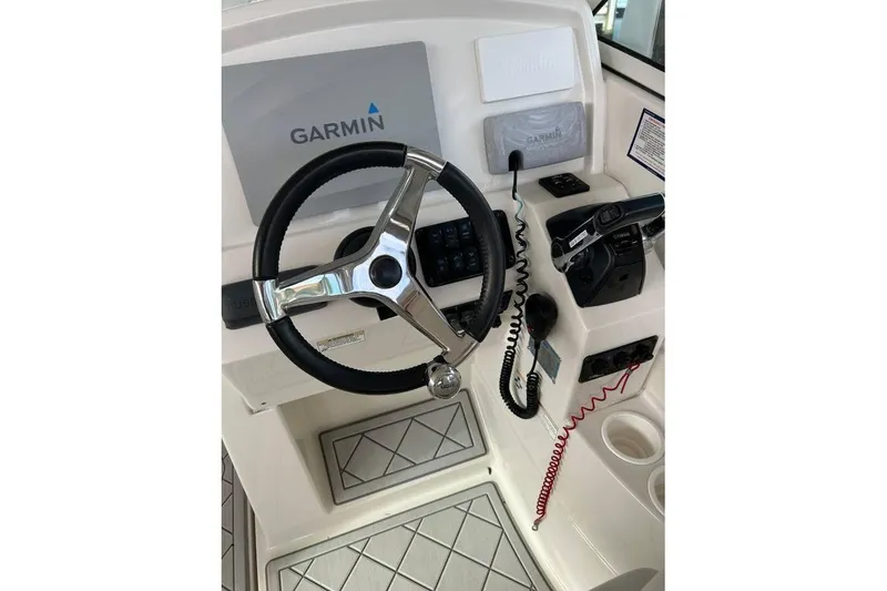 Slide: The Image of Steering console of 2016 Sailfish 275 DC boat with Garmin navigation system. - 12