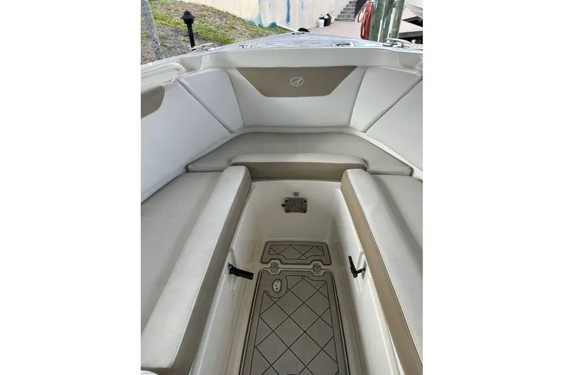 Slide: The Image of Interior view of 2016 Sailfish 275 DC boat with cushioned seating. - 15